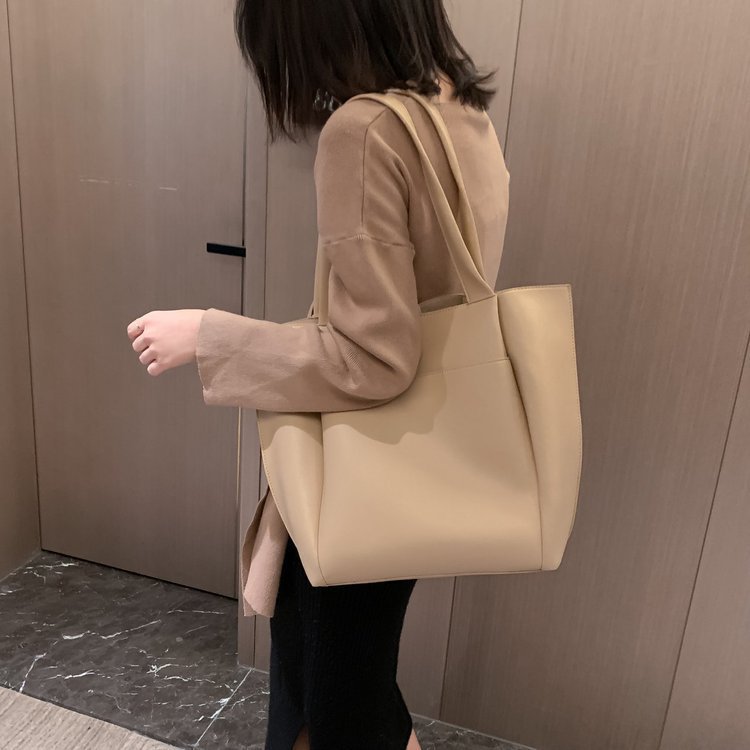 Light beige large-capacity tote handbag with two top handles and wide, open design