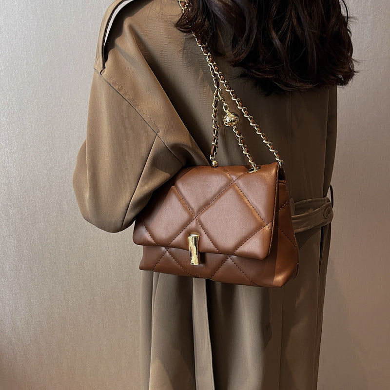 Coffee-brown quilted diamond messenger bag with gold chain strap and bar lock