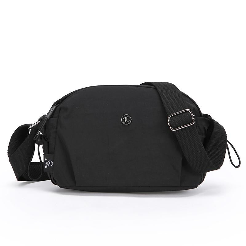 Black nylon crossbody bag with front logo and adjustable shoulder strap, zip closure