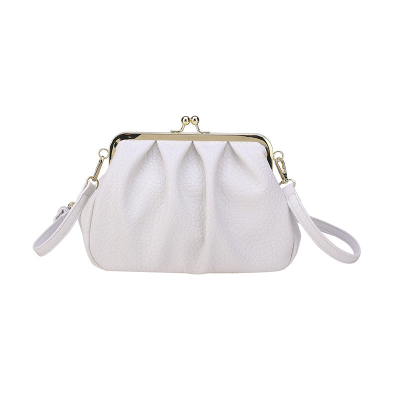 White textured clutch-style handbag with kiss-lock frame and side straps