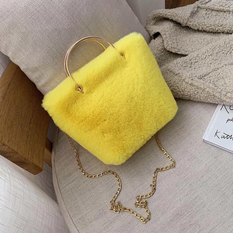 Yellow plush mini shoulder bag with gold chain strap and copper hoop handle