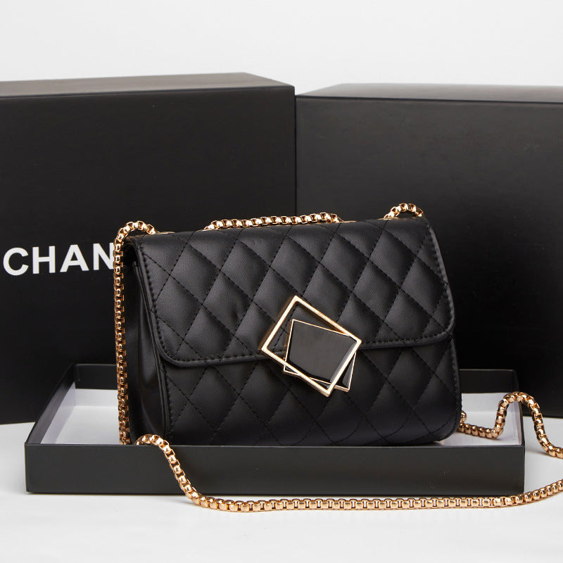 Black quilted mini square crossbody bag with flap, gold chain, and diamond clasp