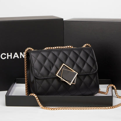 Black quilted mini square crossbody bag with flap, gold chain, and diamond clasp