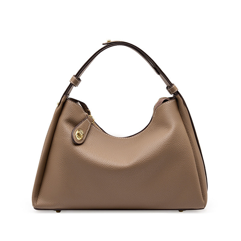 Beige hobo crossbody shoulder bag with curved handles and gold front snap clasp
