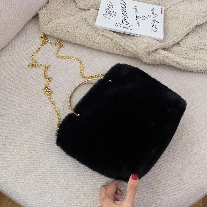 Black plush shoulder bag with gold chain strap and copper hoop handle, mini