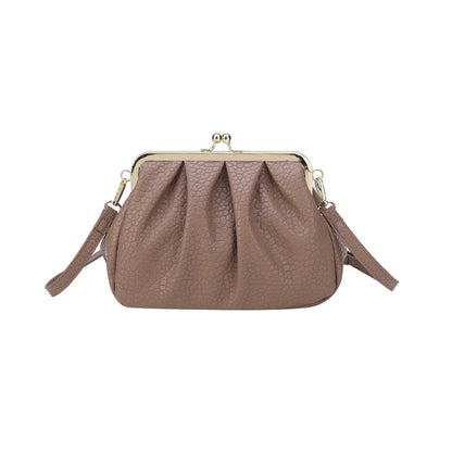 Taupe textured clutch-style handbag with kiss-lock frame and side straps