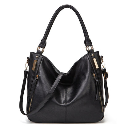 Black leather-look hobo tote with top handles and zippered exterior pockets