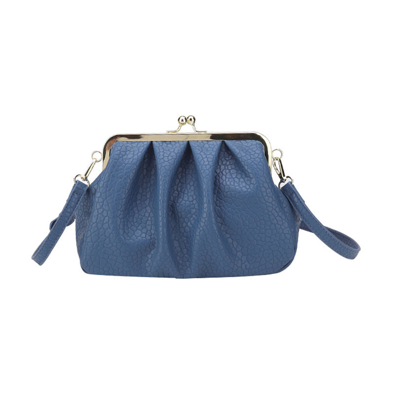 Blue textured clutch-style handbag with kiss-lock frame and side straps