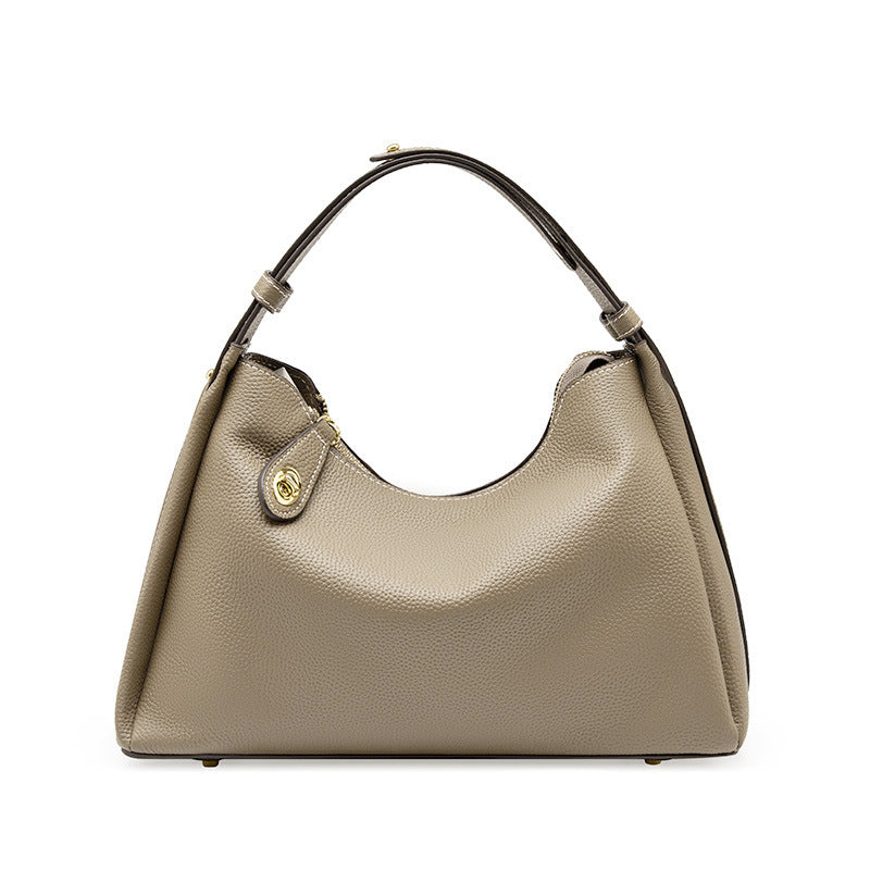 Beige hobo crossbody shoulder bag with curved handle and gold-tone front clasp
