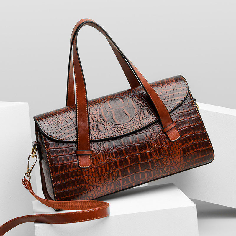 Cognac brown croc-pattern hand carry shoulder bag with top handles and crossbody strap