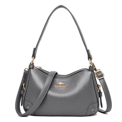 Women’s one-shoulder messenger bag in gray soft leather with gold-tone hardware.