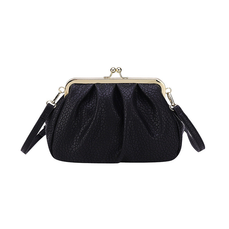 Black textured clutch-style handbag with kiss-lock frame and side straps