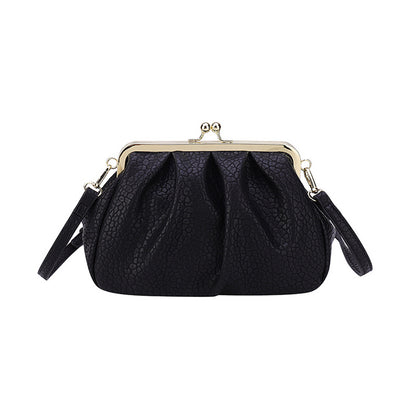Black textured clutch-style handbag with kiss-lock frame and side straps