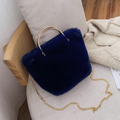 Blue plush mini shoulder bag with gold chain strap and copper hoop handle