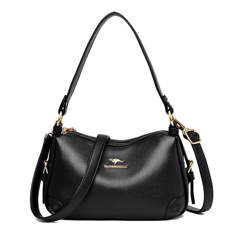 Women’s one-shoulder messenger bag in black soft leather with gold-tone hardware.