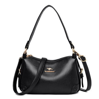 Women’s one-shoulder messenger bag in black soft leather with gold-tone hardware.