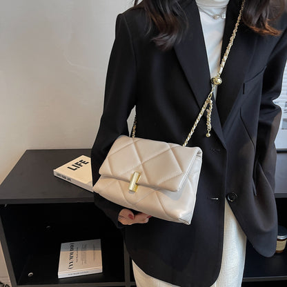 Off-white quilted diamond messenger bag with gold chain strap and front bar lock