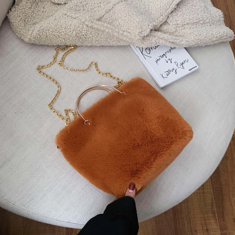 Orange plush shoulder bag with gold chain strap and copper hoop handle, mini