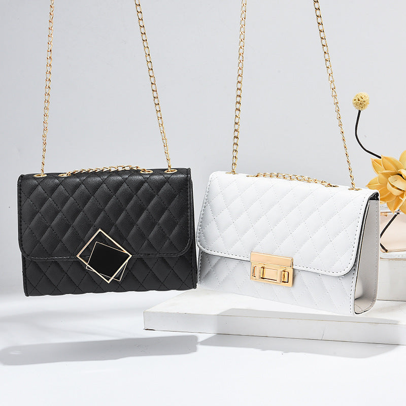 Black and white quilted mini square crossbody bags with gold chains and front clasps