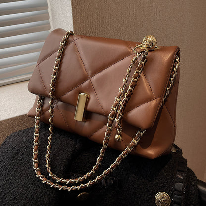 Brown quilted diamond messenger bag with gold chain strap and front bar lock