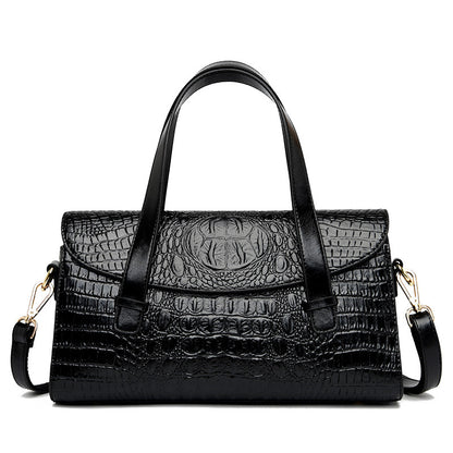 Black croc-pattern hand carry shoulder bag with top handles and adjustable shoulder straps