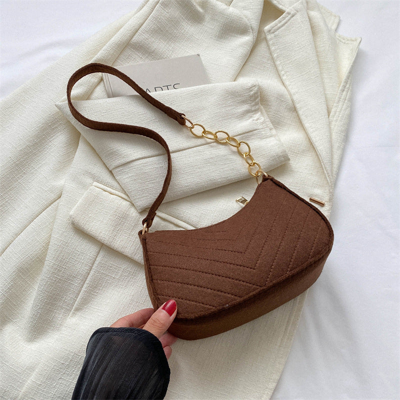 Brown felt crossbody bag with gold chain and adjustable brown shoulder strap