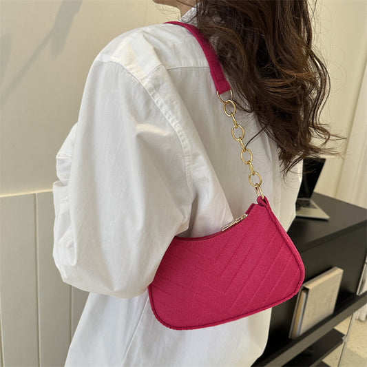 Felt crossbody bag, bright pink with gold chain strap and curved flap