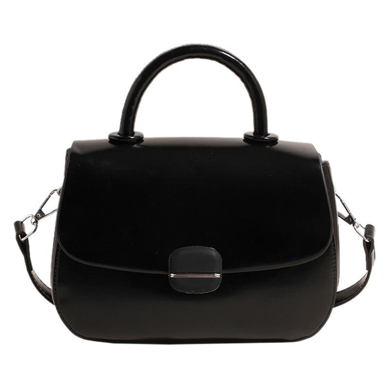 Black double-layer crossbody handbag with top handles, flap front, and side shoulder straps
